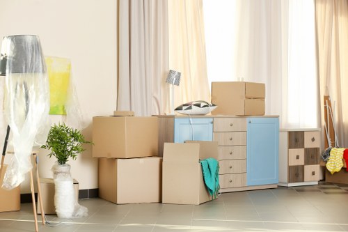 Office relocation planning in Millbank with moving boxes and desks
