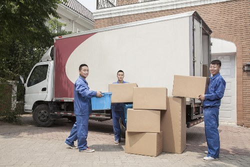 Millbank Storage team separating cardboard and recyclable materials at a storage facility