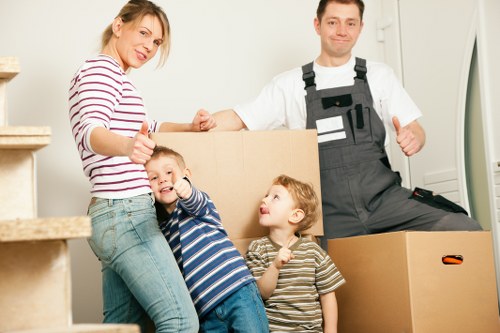 Packed moving boxes and protective wrapping for Millbank removals